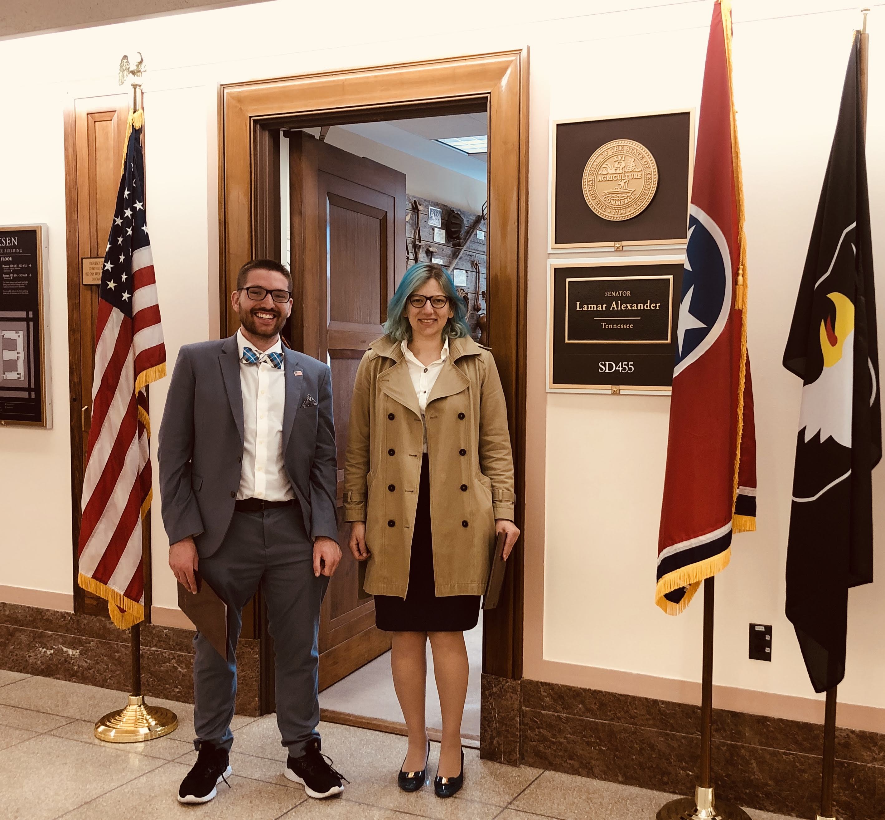 Serena and colleague Willie Boag standing in front of a doorway in Congress.